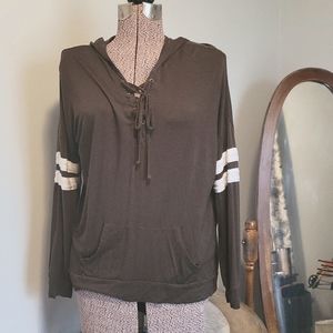 Long sleeve hoodie with pocket. Lightweight and comfy. Sits at waist